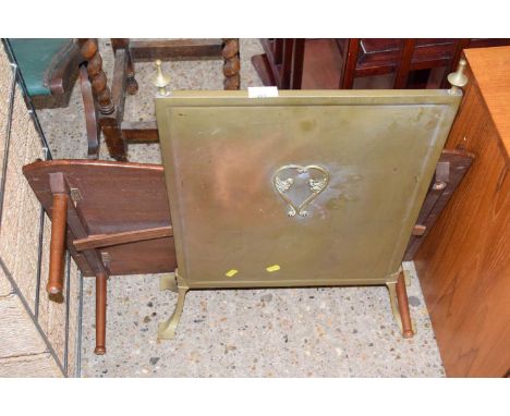 A brass fire screen and an over the bed table