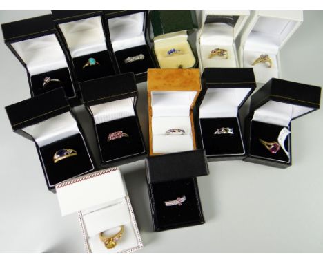 Sixteen dress rings in boxes including rainbow sapphire, tanzanite, opal etc mainly TV shopping purchases