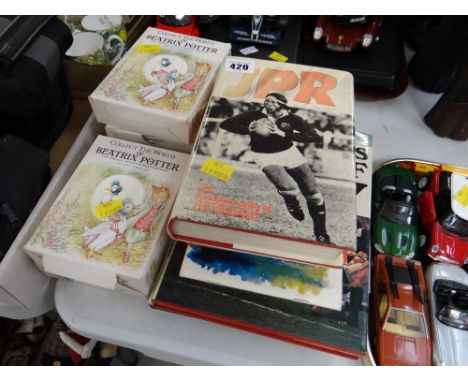 Collection of Welsh rugby books including a signed J P R Williams autobiography & a collection of Beatrix Potter books