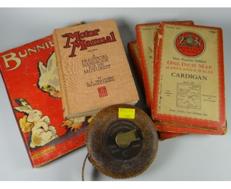 A parcel of items including old ordnance survey maps, tape measure, tin of dominoes