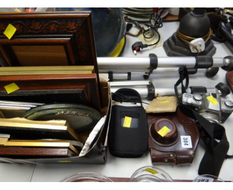 A parcel of camera equipment, tripod, parcel of frames etc