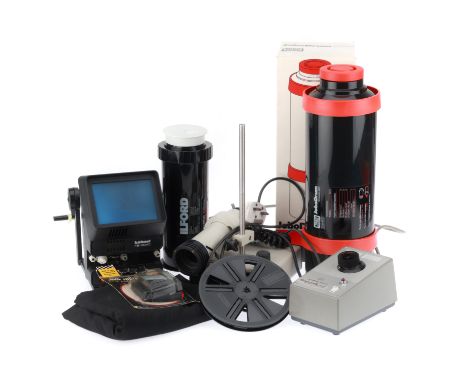 to include two developing tanks, a timer, a focused lamp, a movie editor,