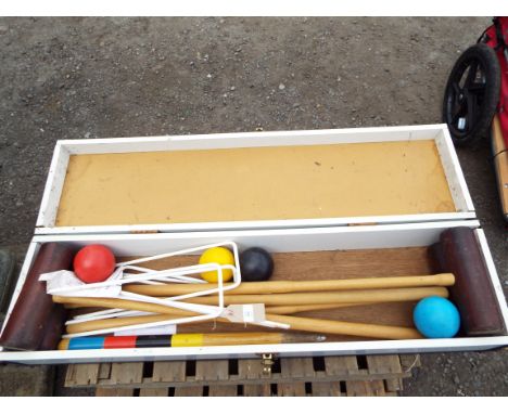 A vintage croquet set in original case