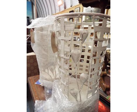 Two cream painted wrought iron floral decorated stick-stands