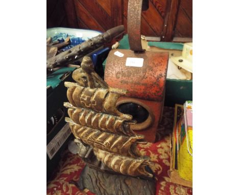 A vintage lamp and door stop in the form of a galleon