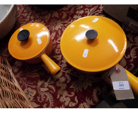 Two vintage French enamelled cast iron pans with lids by Cousances