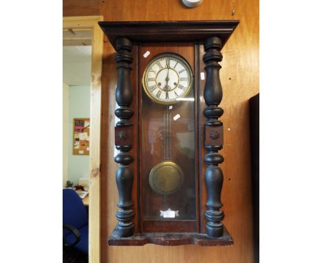A late 19thC mahogany cased Vienna wall clock