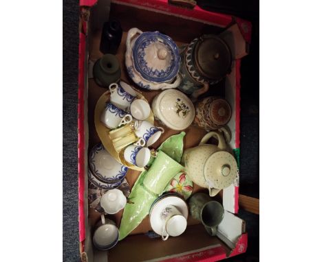 A Susie Cooper hot water jug, an early Carlton ware biscuit barrel, Royal Worcester blue and white coffee cans, Carlton ware 