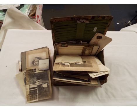 A mixed selection of vintage postcards and photographs