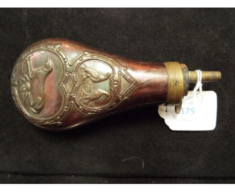 A vintage gunpowder flask having dog and game bird decoration      15.5cm long including nozzle x 7cm wide