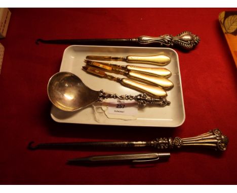 A good quality silver plated apostle spoon, two silver handled button hooks, silver yard 'o lead pencil and four London 1926 