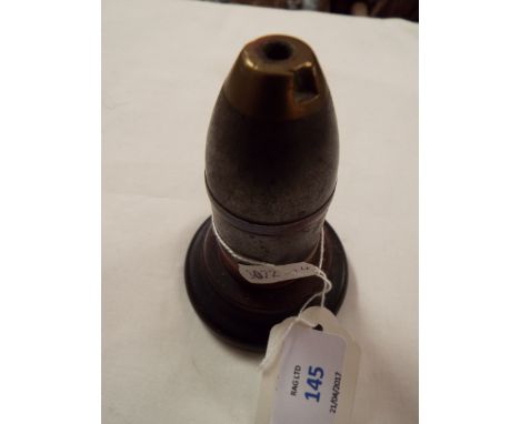 A trench art paperweight made from a WWI shell 