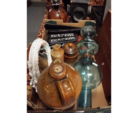 A selection of miscellaneous items to include a blue glass oil lamp, stoneware bottles, flagon, reproduction cast iron signs 