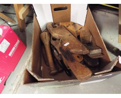 A small selection of vintage wooden tools to include planes, saw, hammer, scrapers etc
