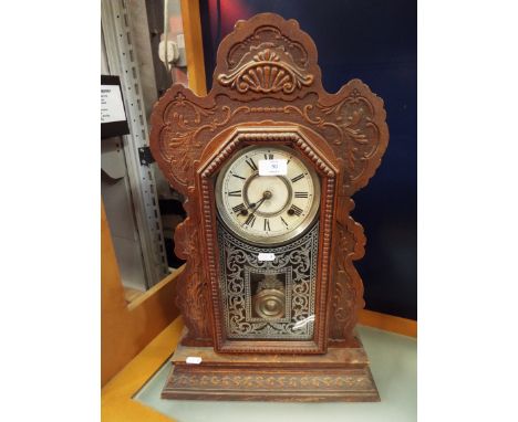 An American Ansonia carved gingerbread clock 