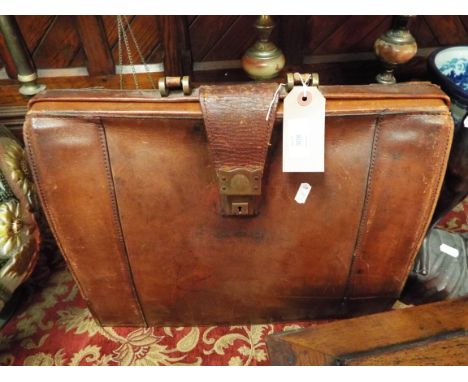 A vintage brown leather attache case     17" wide x 13.5" high