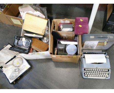 Two boxes of dressing table sets, place mats, empty jewellery boxes, Brother Deluxe typewriter