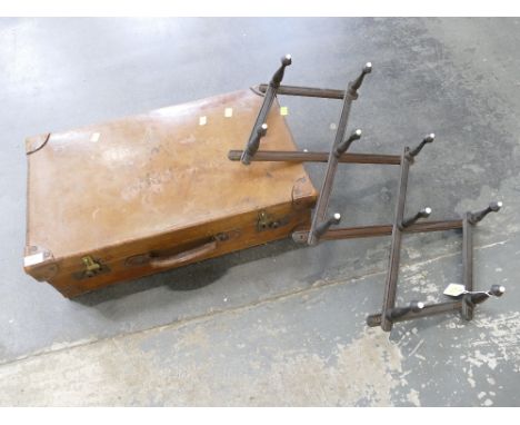 Vintage leather suitcase and extendable wooden coat hanger