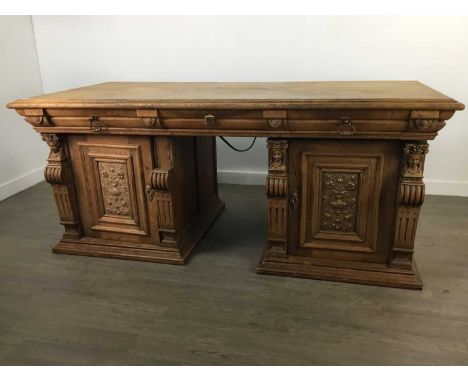 EARLY 20TH CENTURY CARVED OAK DESK,168cm wideWell used item. Gaps in top planks, missing original back.&nbsp; One carved bloc