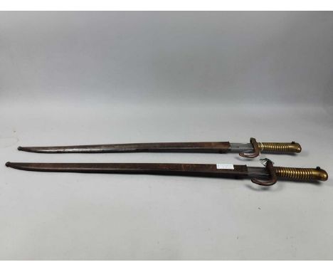 TWO 19TH CENTURY FRENCH BAYONETS,with scabbardsSome small dents present to one of the scabbards. Scabbard 24804 &amp; blade J