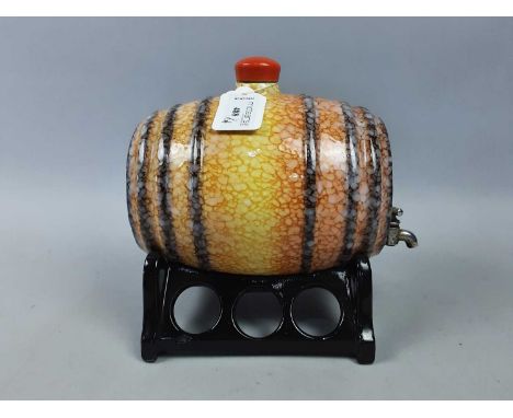 CERAMIC SPIRIT BARREL,20cm high, along with three glass whisky decanters, a brass and copper jug, three miniature ones, conta