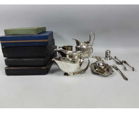 COLLECTION OF SILVER PLATE,including boxed flatware, a helmet form cream jug, two sauceboats, candle snuffers and stand