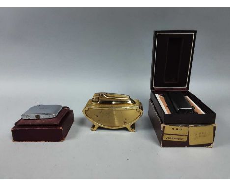 THREE CIGARETTE LIGHTERS,two Ronson including a table lighter and a Colibri, together with cigarette cases, an ash tray, a Co