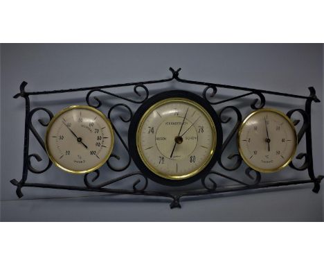 A Veranderlich thermometer, hygrometer and barometer, in cast metal frame, H.16 W.35cm 