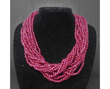 A 15 strand ruby necklace, with gold plated and cubic zirconia set leopard head clasp 