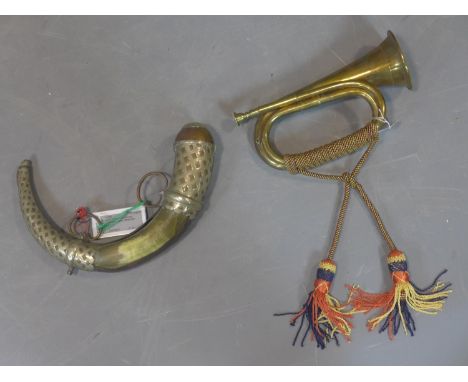 A brass bugle with tassels, L.29cm, together with a copper and horn mounted powder horn, L.34cm (2) 