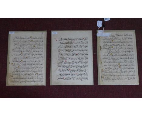Three ancient manuscript pages of the Koran 