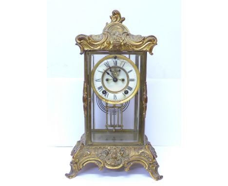 A 19th Century American rococo revival gilt metal and glass four sided clock, by Ansonia, New York