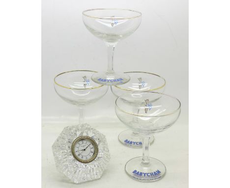 A Waterford crystal clock and four Babycham glasses