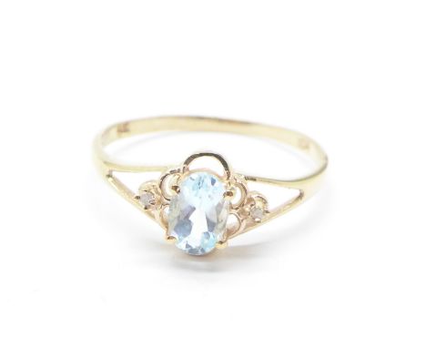 A 9ct gold, blue topaz and diamond ring, 1.1g, O