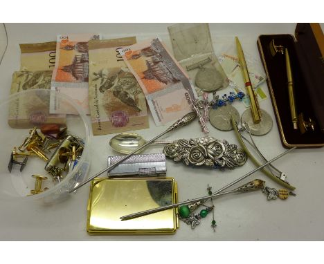 A WWII medal, cufflinks, pens, lighter and a silver spoon