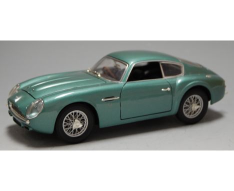 A 1/18th scale model of an Autoart Aston Martin DB4 GT in a CMC box    Condition Report / Extra Information  Boxed and in pol