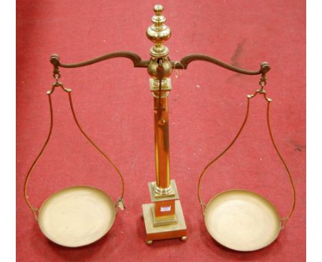 A pair of large early 20th century turned brass beam scales, h.82cm