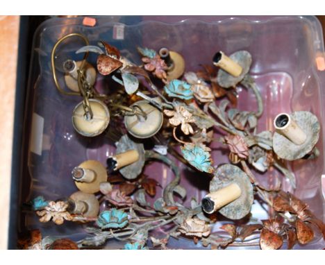 A pair of 20th century pressed metal and painted twin sconce floral encrusted wall light fittings; together with a brass ceil
