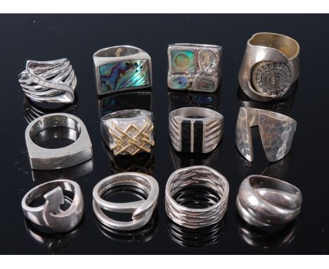 A collection of twelve various silver and other mixed metal contemporary abstract design dress rings, to include two mother o