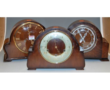 A 1950s Enfield oak cased mantel clock; together with two other similar examples (3) 