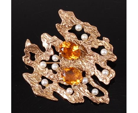 Deakin & Francis - A late 1960s 9ct gold abstract brooch, of pierced and naturalistic raised form, set with two central oval 