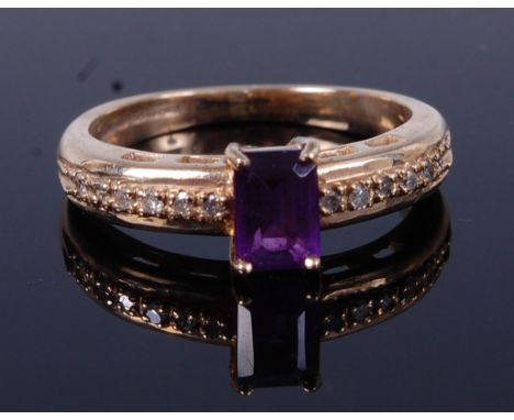 A modern 9ct gold amethyst set dress ring, the shoulders further set with graduated small diamonds, 2.9g, size K