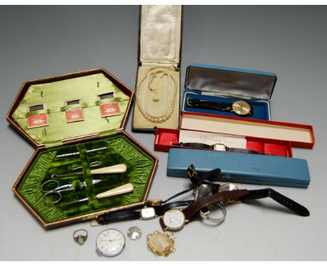 An early 20th century lady's sewing set, in green felt lined leather case (incomplete); together with a simulated pearl singl