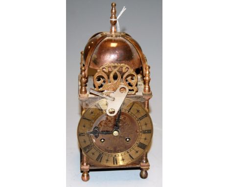 A 17th century style brass cased lantern clock by Smiths having a brass chapter ring with Roman numerals engraved and matt ce