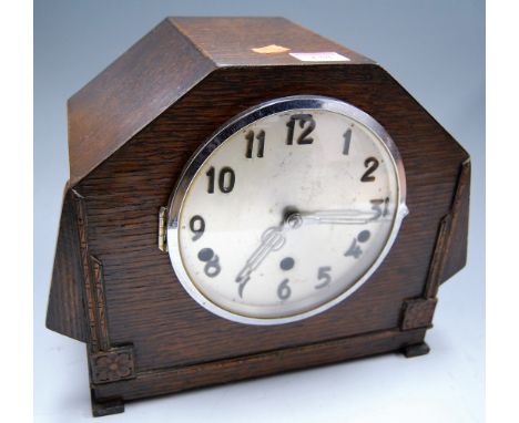 A 1930's/40's Whittington & Westminster Chime oak cased mantel clock, having a silvered dial with Arabic numerals and eight d