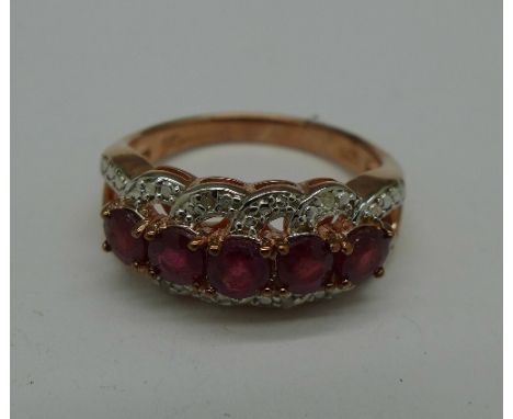 A silver gilt, ruby and diamond ring, P