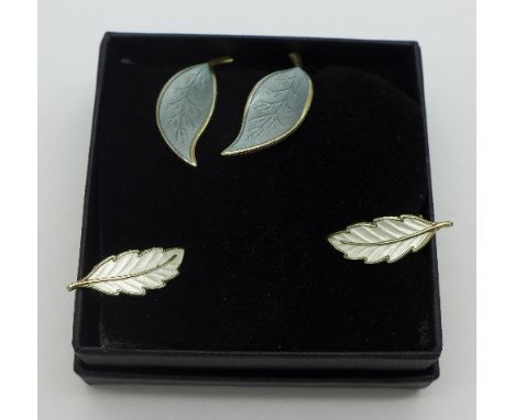 A pair of silver and enamel clip on earrings by David Andersen and one other similar pair of earrings marked Norway