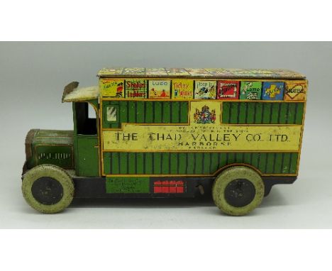 A Chad Valley tin-plate clockwork lorry with key, length 25cm, back door a/f