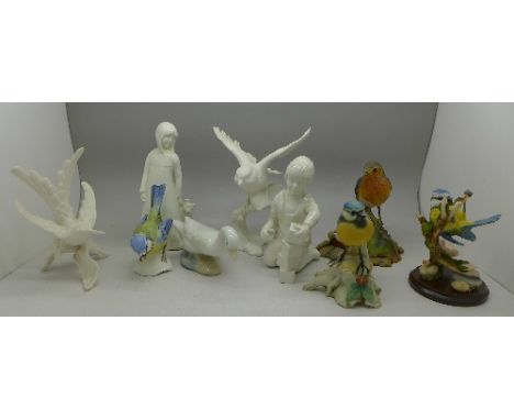 Two Goebel white bird figures, a Border Fine Arts robin, a Goebel blue tit, etc.