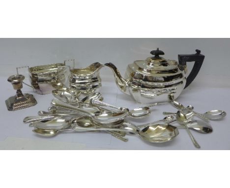 A silver dwarf candlestick, a three piece plated tea service and plated flatware